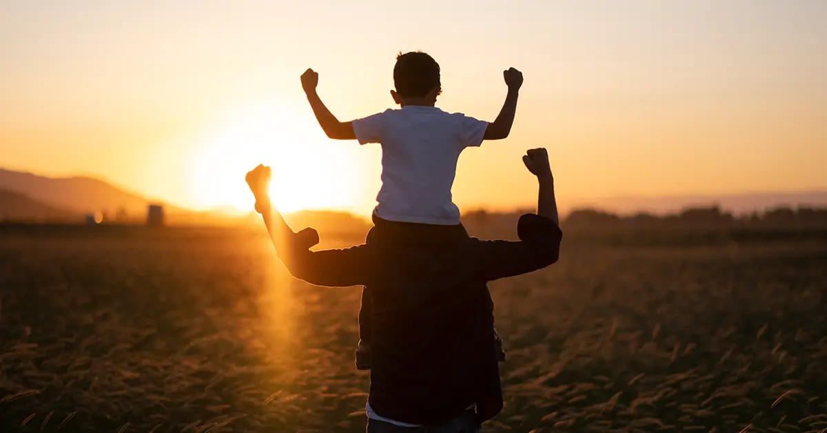 Father and son looking at sunset recommends Family Law services.